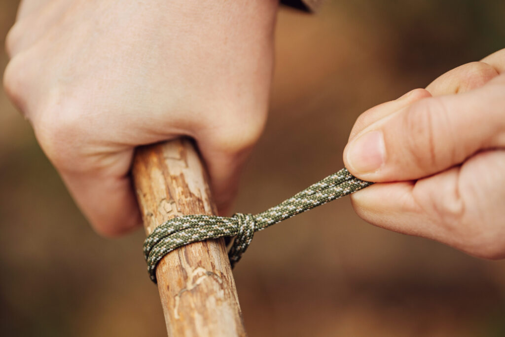 girl ties a knot in the rope